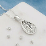 Sterling Silver Mid Size Resin Inlaid Teardrop And Angel Wing Overlay Pendant