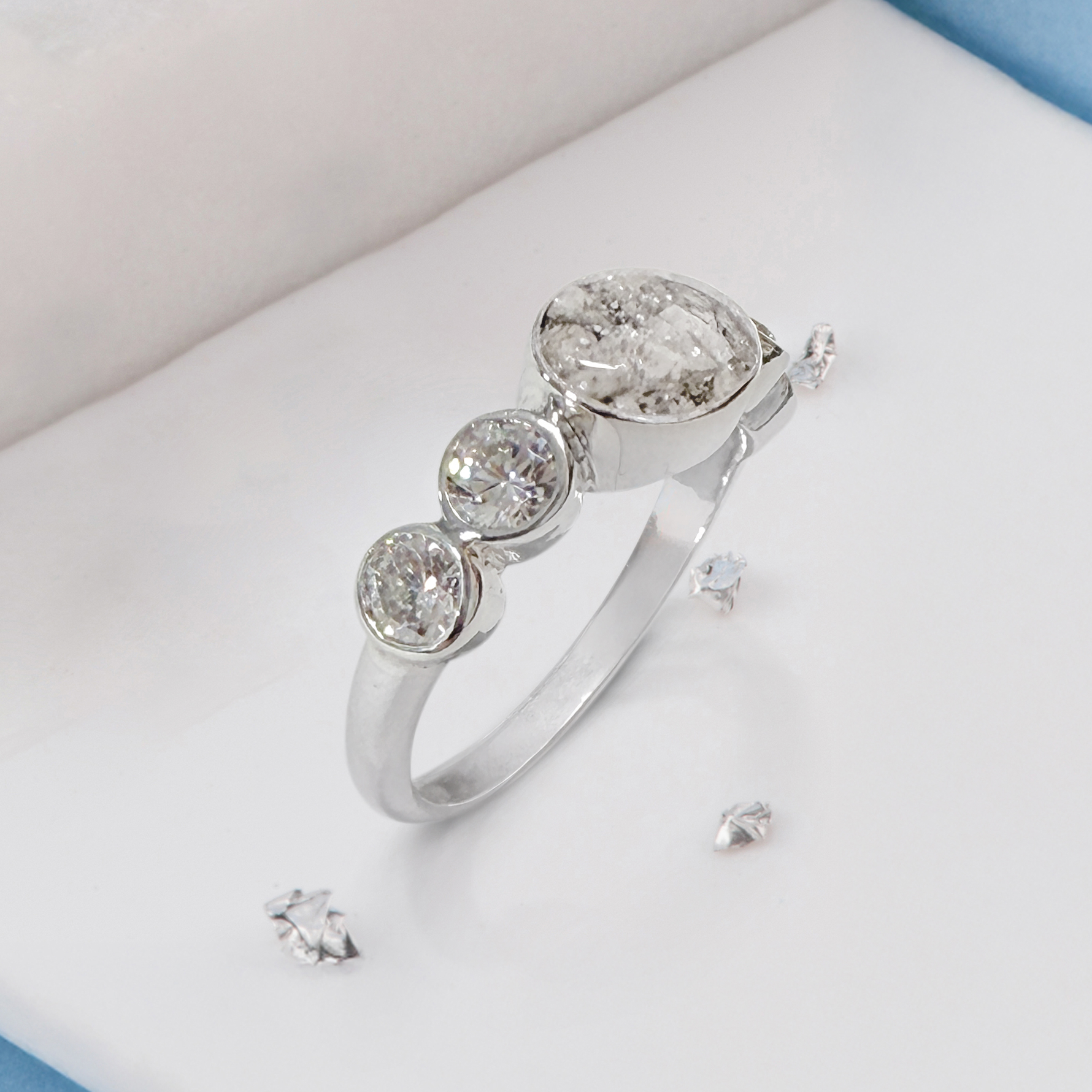 Crystal shoulder oval five stone ashes or hair inlaid ring