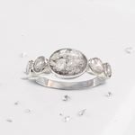 Crystal shoulder oval five stone ashes or hair inlaid ring