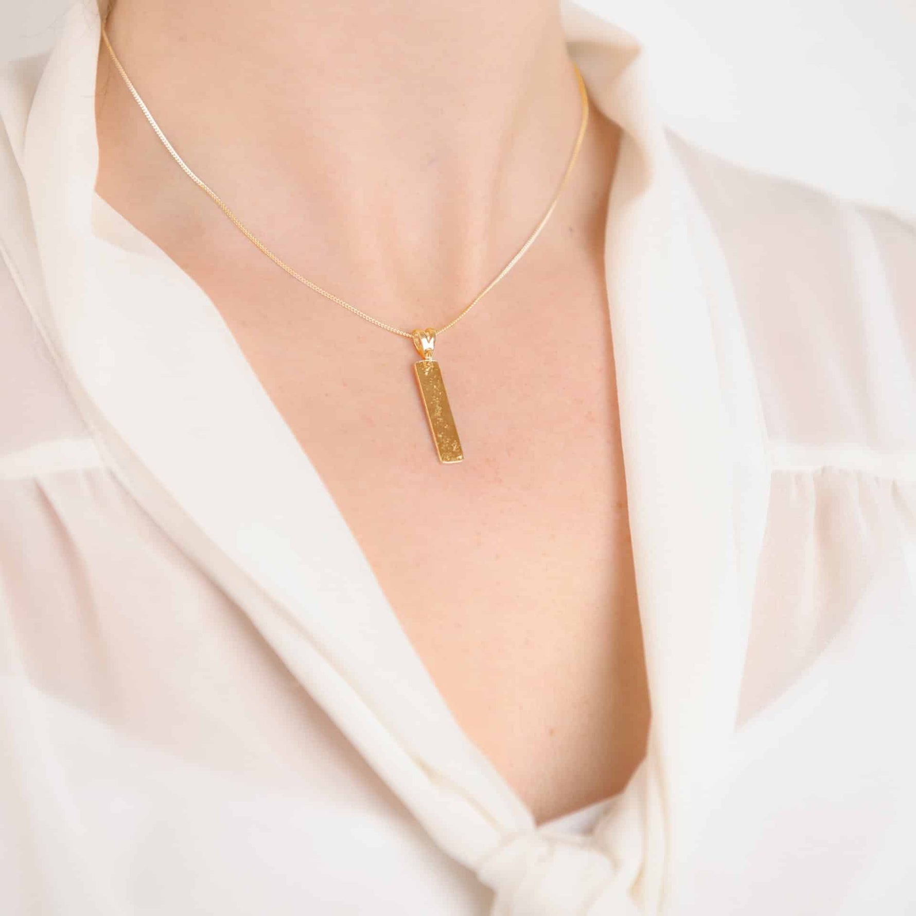 Gold Imprinted Oblong Bar Pendant