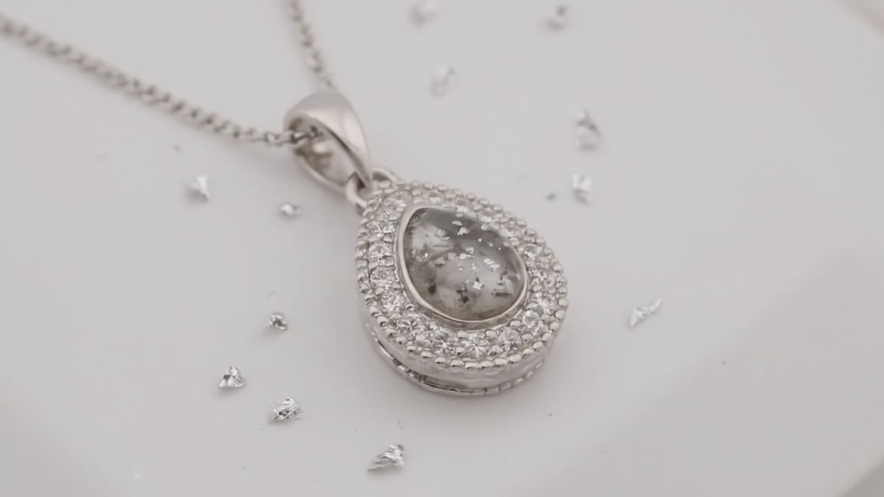 Small teardrop shaped ashes or hair crystal pendant