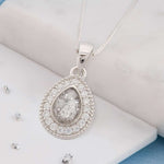 Small teardrop shaped ashes or hair crystal pendant