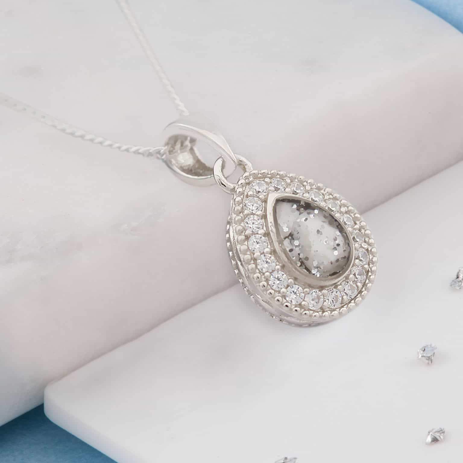 Small teardrop shaped ashes or hair crystal pendant