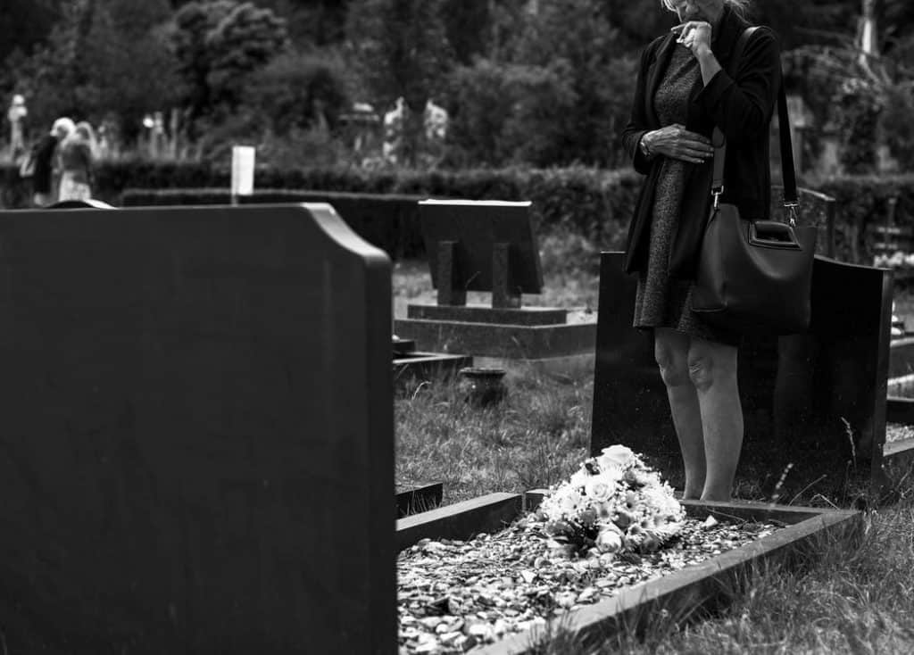 Women mourning at a grave