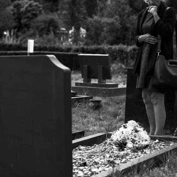 Women mourning at a grave
