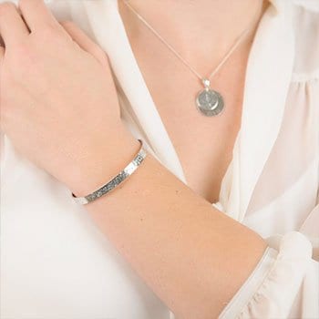 Model Wearing a Silver Rolled Ashes Torque Bangle