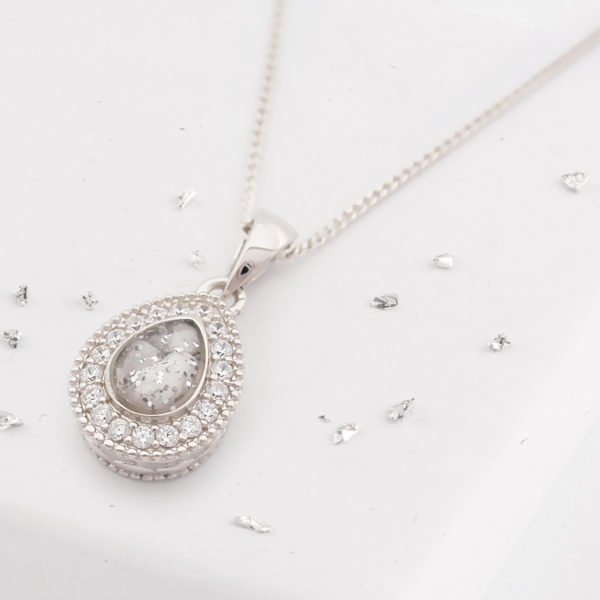 Small teardrop shaped ashes or hair crystal pendant